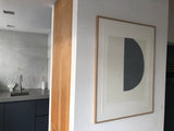Serigraphy print 'Big Grey' crafted by Emma Lawrenson in oak wood frame in living room.